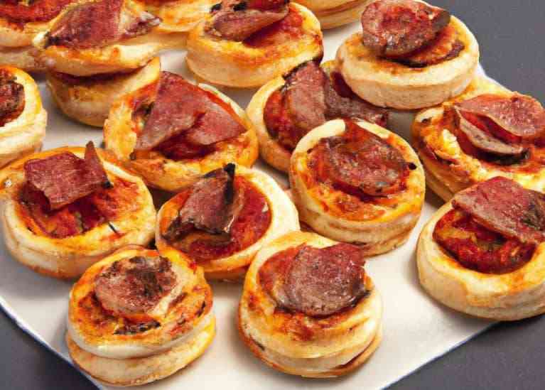 mini party pizzas made with puff pastry and salami sticks