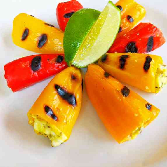 Sweet peppers stuffed with feta cheese, char frilled multiple colors