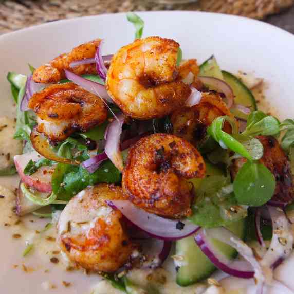 A spicy shrimp salad with peaches and a tangy dressing. 