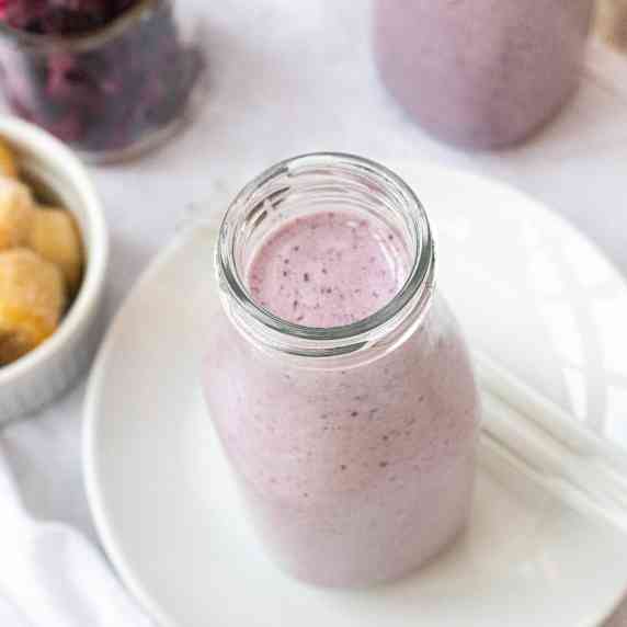 berry smoothie in a milk bottle
