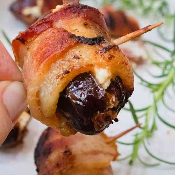 Bacon wrapped date stuffed with goat cheese close up