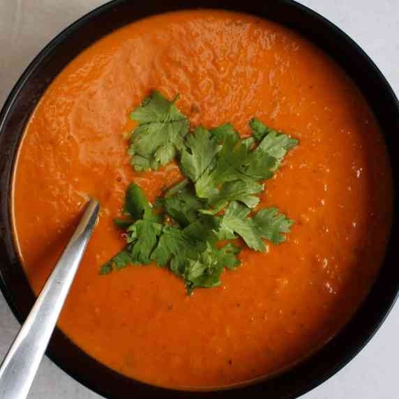 A bowl of spicy Indian tomato soup.