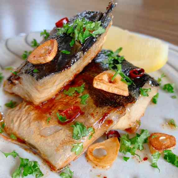 Grilled mackerel and seasoned with garlic, red pepper and soy sauce.