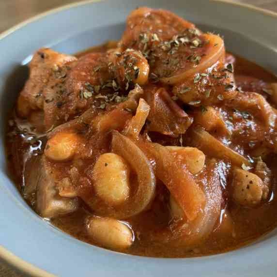 Stewed tomatoes, chicken and soybeans.