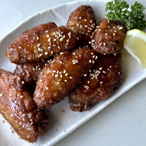 Tebanaka karaage are deep-fried chicken wings coated with a sauce made from soy sauce and sugar. 