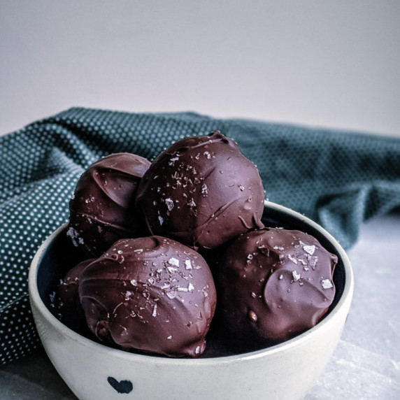 Chocolate peanut butter balls in small bowl 