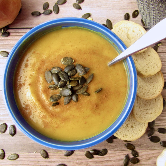 Roasted Butternut Squash Soup with baguette in blue bowl