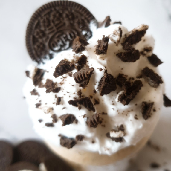 Oreo Iced Coffee Recipe topped with whipped cream and crushed oreos.