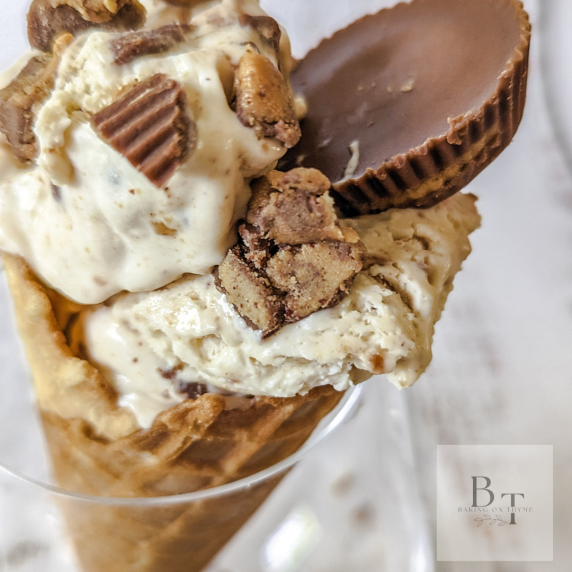 Ice cream waffle cone topped with recess peanut butter chocolate and made with homemade ice cream