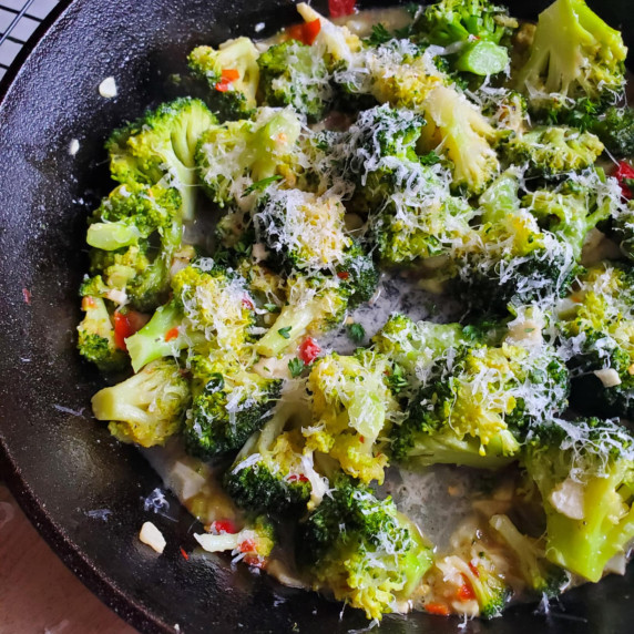 Vibrant, green broccoli with pops of red pepperoncini and a white dusting of grana padano.