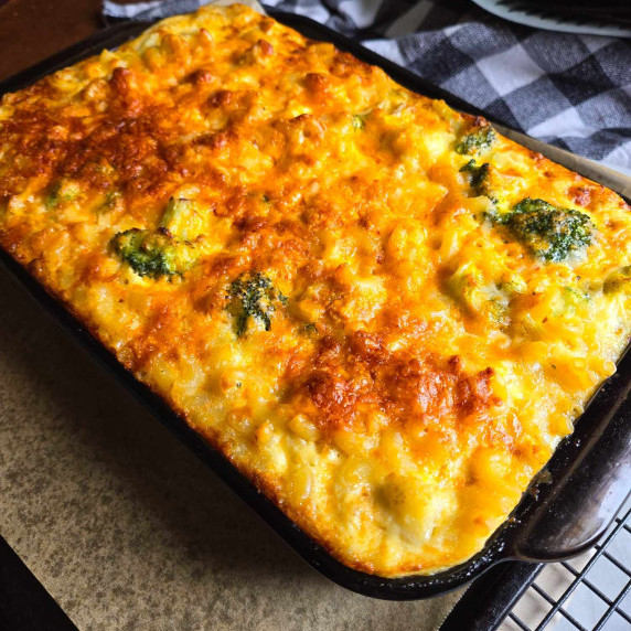 Baking dish full of a golden brown, cheesy baked mac.