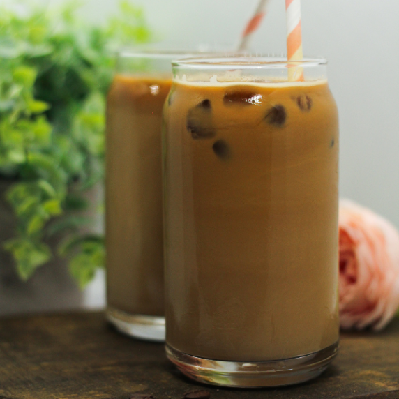 4 Ingredient Chaga Mushroom Iced Coffee with Espresso on a brown surface.