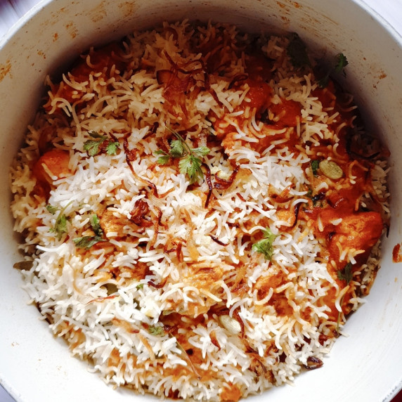 Butter Chicken Biryani in a Dutch oven.