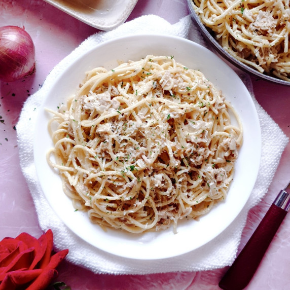 Tuna pasta recipe on a white plate.