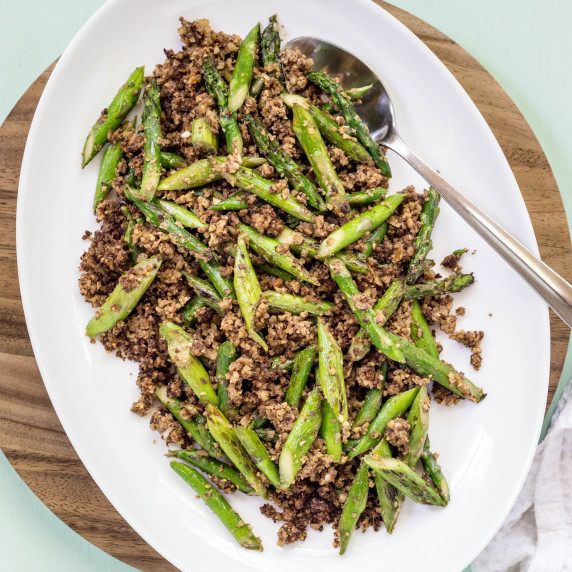Asparagus and Walnut Mushroom meat on a white serving platter. 