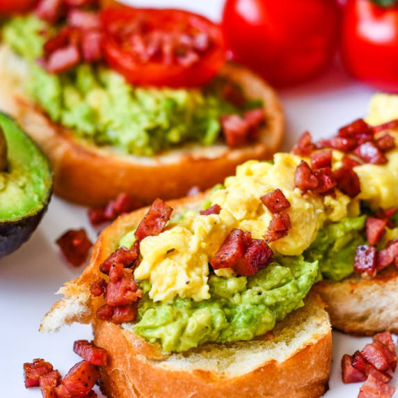 avocado toast with egg, tomato, and deer bacon