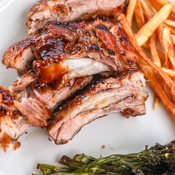 Slow roasted barbecue baby back ribs with homemade french fries.
