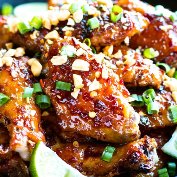 Baked Thai Chicken Wings RECIPE garnished with peanuts and green onions. 