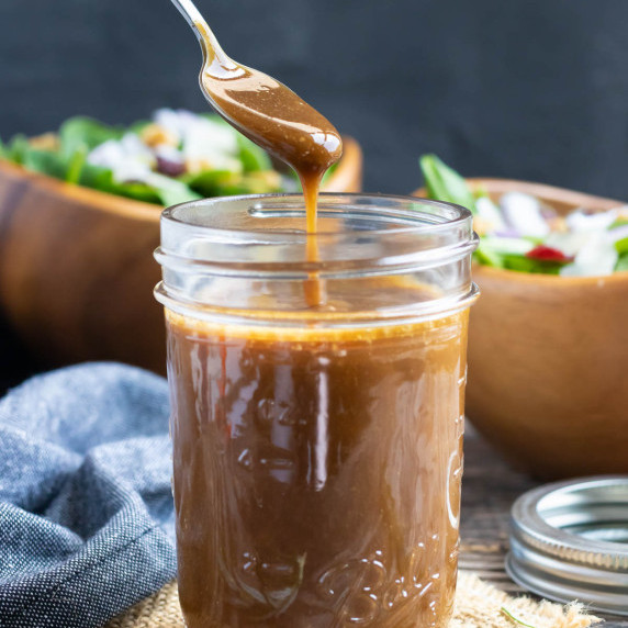 Healthy Balsamic Vinaigrette RECIPE served in a Mason jar with a spoon.