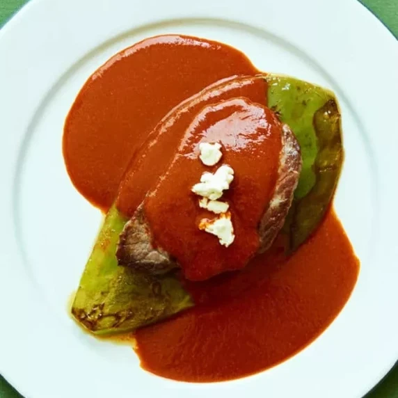 Beef Tenderloin with a Three Chile Sauce serve in white plate