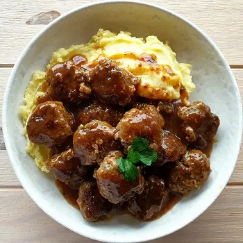 Homemade Meatballs with creamy brown gravy and mashed potatoes