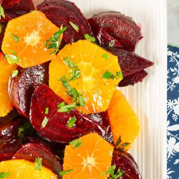 Beet and Orange Salad up close on a white plate.