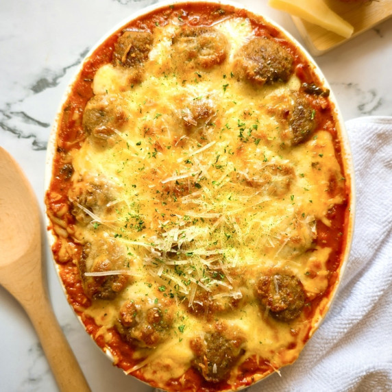 Baked Spaghetti and Meatballs Recipe in a baking dish.