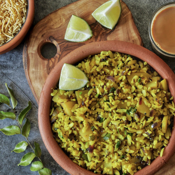 Maharashtrian classic breakfast with flattened rice - batata poha
