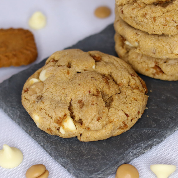 Brown butter Biscoff cookies on a slate platter against a white background