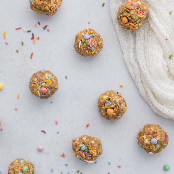 birthday cake protein balls on white surface