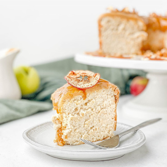 slice of caramel apple angel food cake on a white plate with a fork