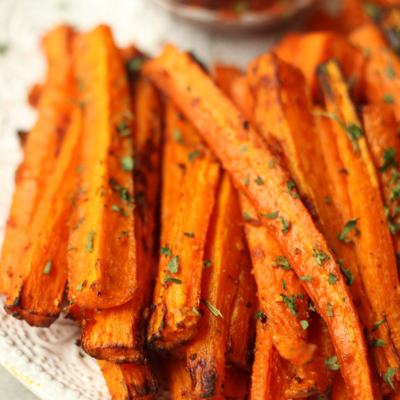 vegan carrot fries in a white bowl