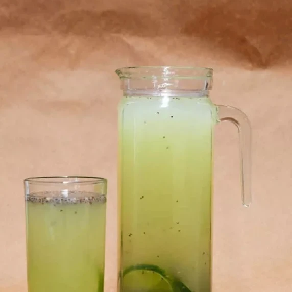 Chia lime water serve in a clear glass and pitcher