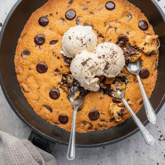 Gooey chocolate chip skillet cookie with a soft center and crisp edges.
