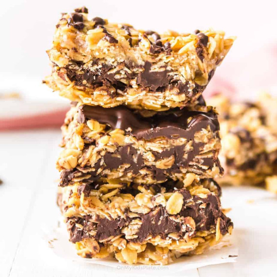 Stack of chocolate oatmeal bars three tall from the side.