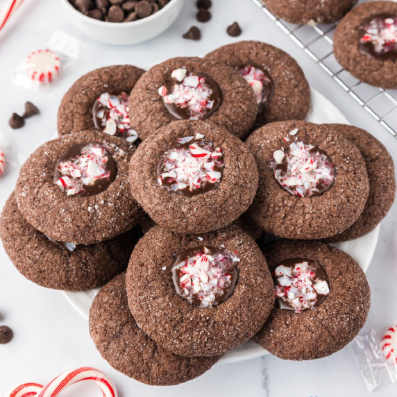 Chocolate peppermint cookies with a chocolate filling topped with crushed candy canes.