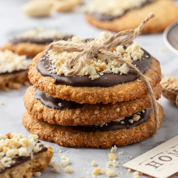 Stack of Crispy Chocolate-Dipped Oatmeal Peanut Cookies