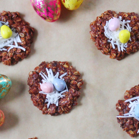 Easter cookies placed over tan parchment paper. 
