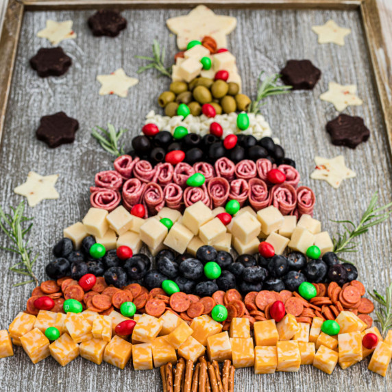 A Christmas Charcuterie Board made from cold cuts and cheese.