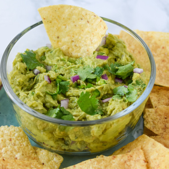 Classic Guacamole with tortilla chips.