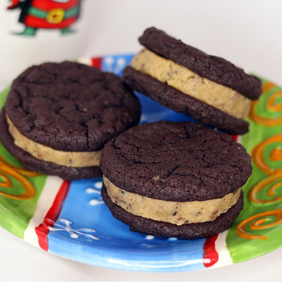 Cookies and Cream Cookie Dough Brownie Sandwiches on a holiday plate.