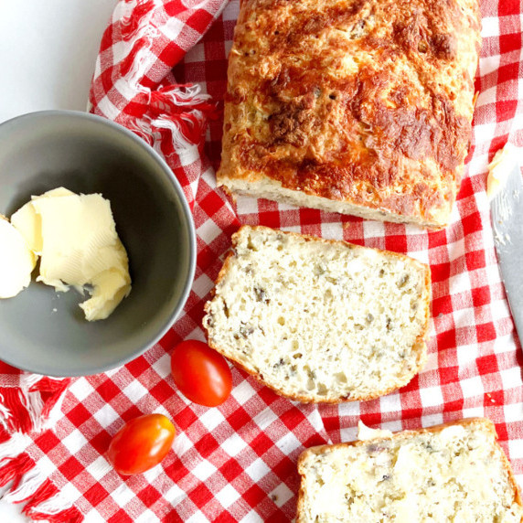 overhead shot of quick bread on a red and white checked cloth