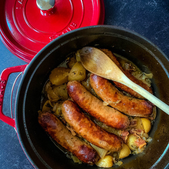a red pot with sausages