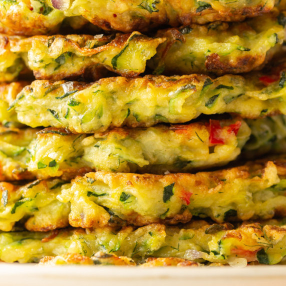 A stack of crispy zucchini fritters.