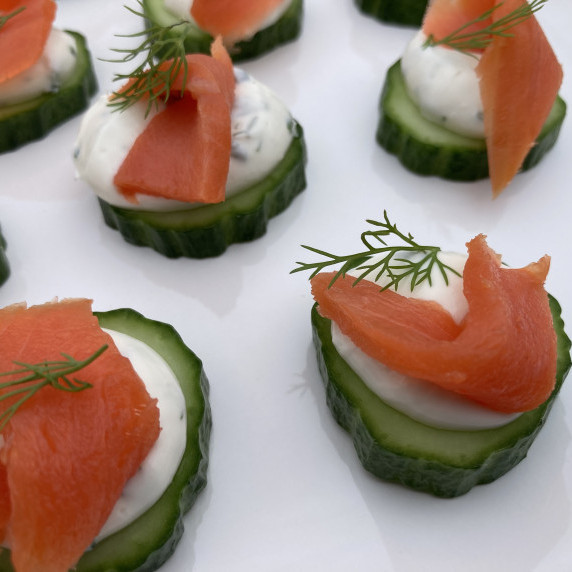 Cucumber slices topped with herbed cream cheese, salmon and fresh dill.