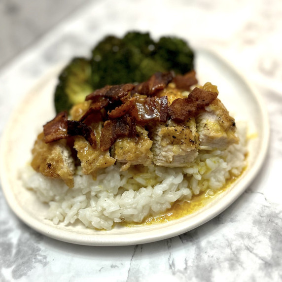 Curry Chicken Delight served over white rice with a side of roasted broccoli.