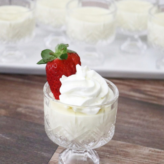 Vanilla Pudding with whipped cream and fresh Strawberry on top