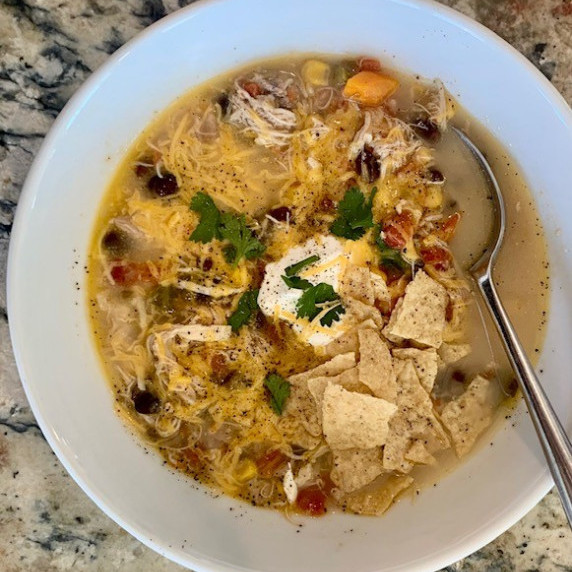 Gluten Free Chicken Tortilla Soup for the Instant Pot topped with sour cream, cilanto & cheddar