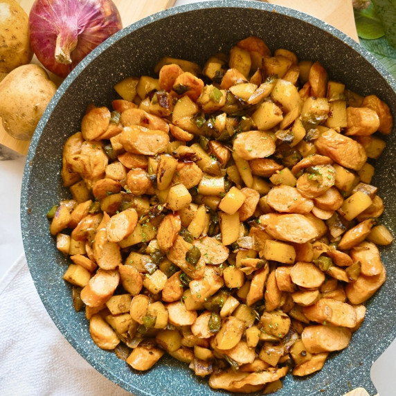 Potato sausage recipe in a large pan.