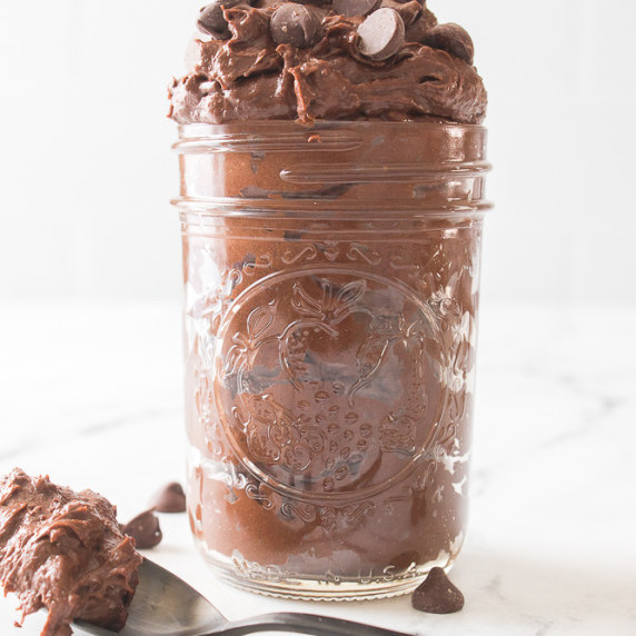Glass jar filled with edible brownie batter.